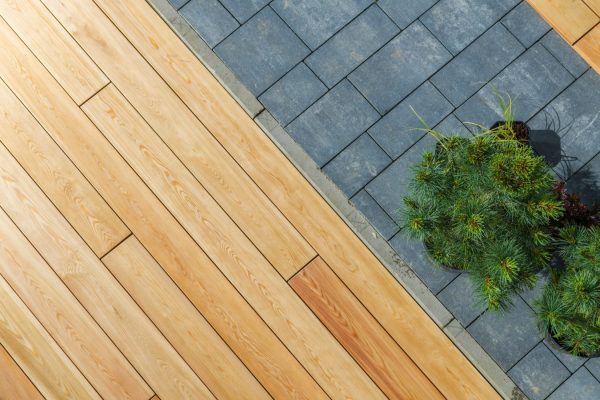 Wood Deck and Concrete Bricks Pavement in a Garden Wood Deck and Concrete Bricks Pavement in a Garden